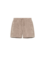 Beige mid-length shorts made of terry toweling fabric with an elastic drawstring waist, two side pockets, and one back pocket with embroidery.