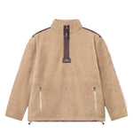 A beige-colored half zip fleece pullover with two front zipper pockets and a ' Nikben ' patch on the chest.