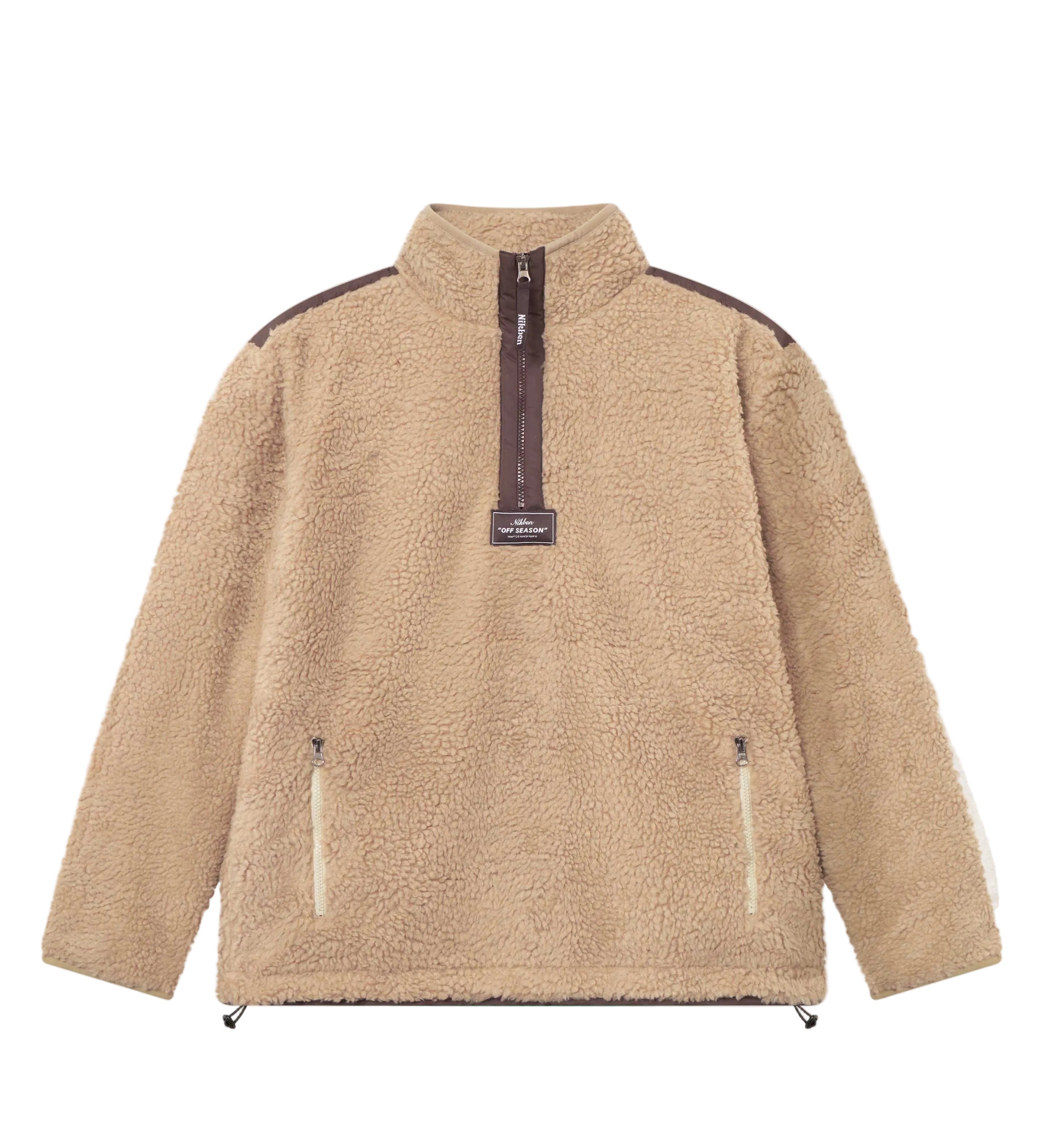 A beige-colored half zip fleece pullover with two front zipper pockets and a ' Nikben ' patch on the chest.
