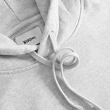Close up of drawstrings on a grey hoodie
