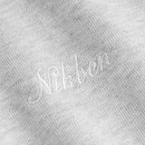 Close up of Nikben script logo embroidery on a grey hoodie