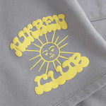 Close up of yellow Nikben Sunshine Club print on grey sweat shorts