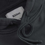 Close up of drawstrings on black cropped hoodie