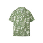 A short-sleeved green shirt with a multicolor graphic pattern, an open collar, and a button closure at the front.