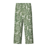 A pair of green pants with a multicolor graphic pattern, including geometric shapes and plant-like designs.