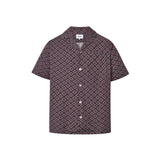 A short-sleeved brown shirt with a multicolor geometric pattern, an open collar, and button closures at the front.