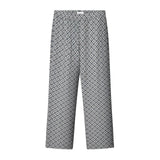 A pair of steel blue geometric patterned pants with a relaxed fit and side pockets.
