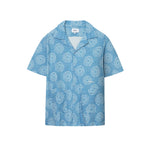 A short-sleeved blue shirt with a geometric pattern and mother-of-pearl buttons, displayed against a white background.
