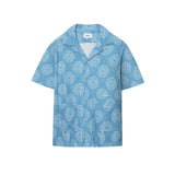 A short-sleeved blue shirt with a geometric pattern and mother-of-pearl buttons, displayed against a white background.