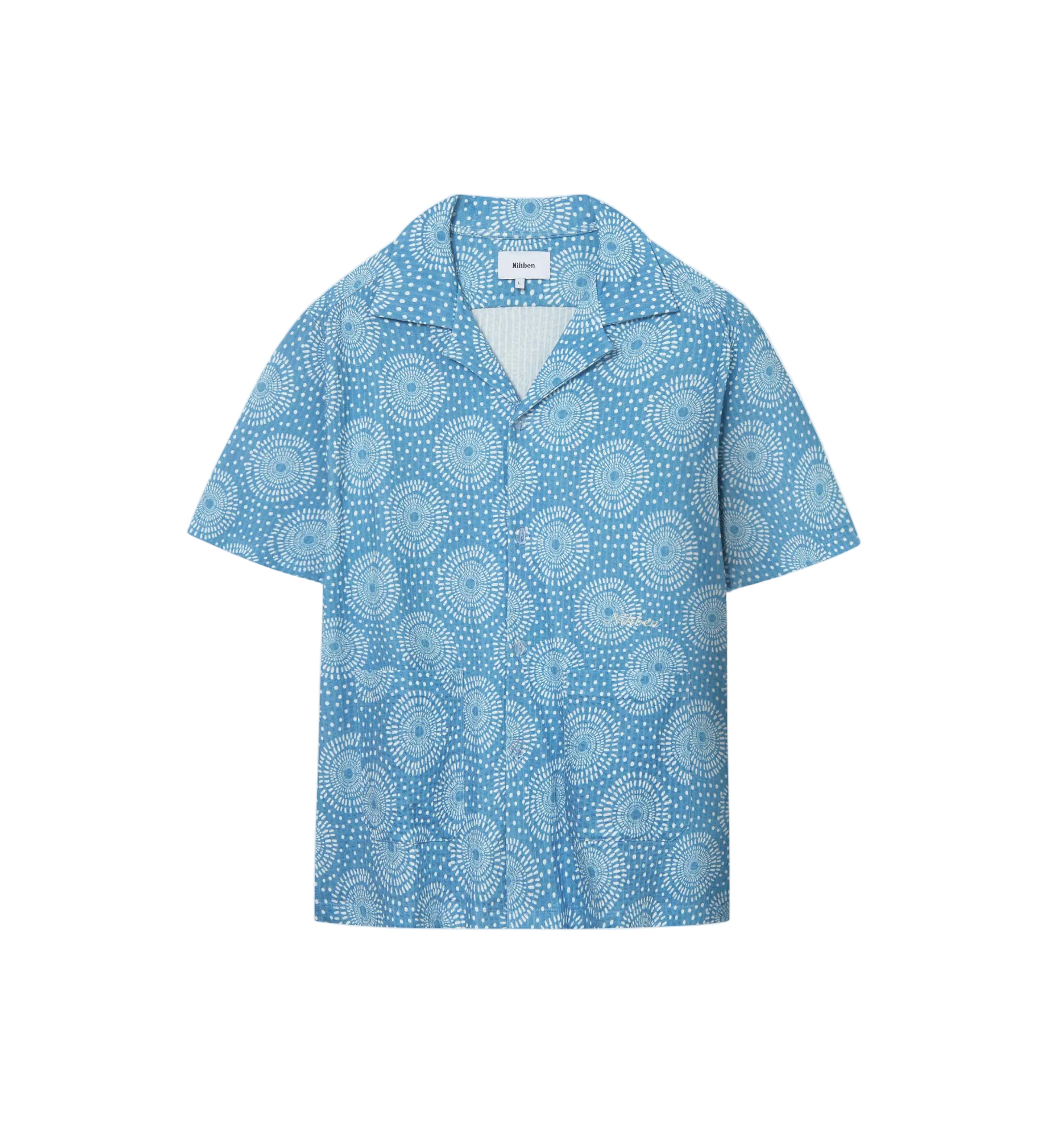 A short-sleeved blue shirt with a geometric pattern and mother-of-pearl buttons, displayed against a white background.