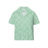 A short-sleeved green shirt with a camp collar and mother-of-pearl buttons, displayed against a plain background.