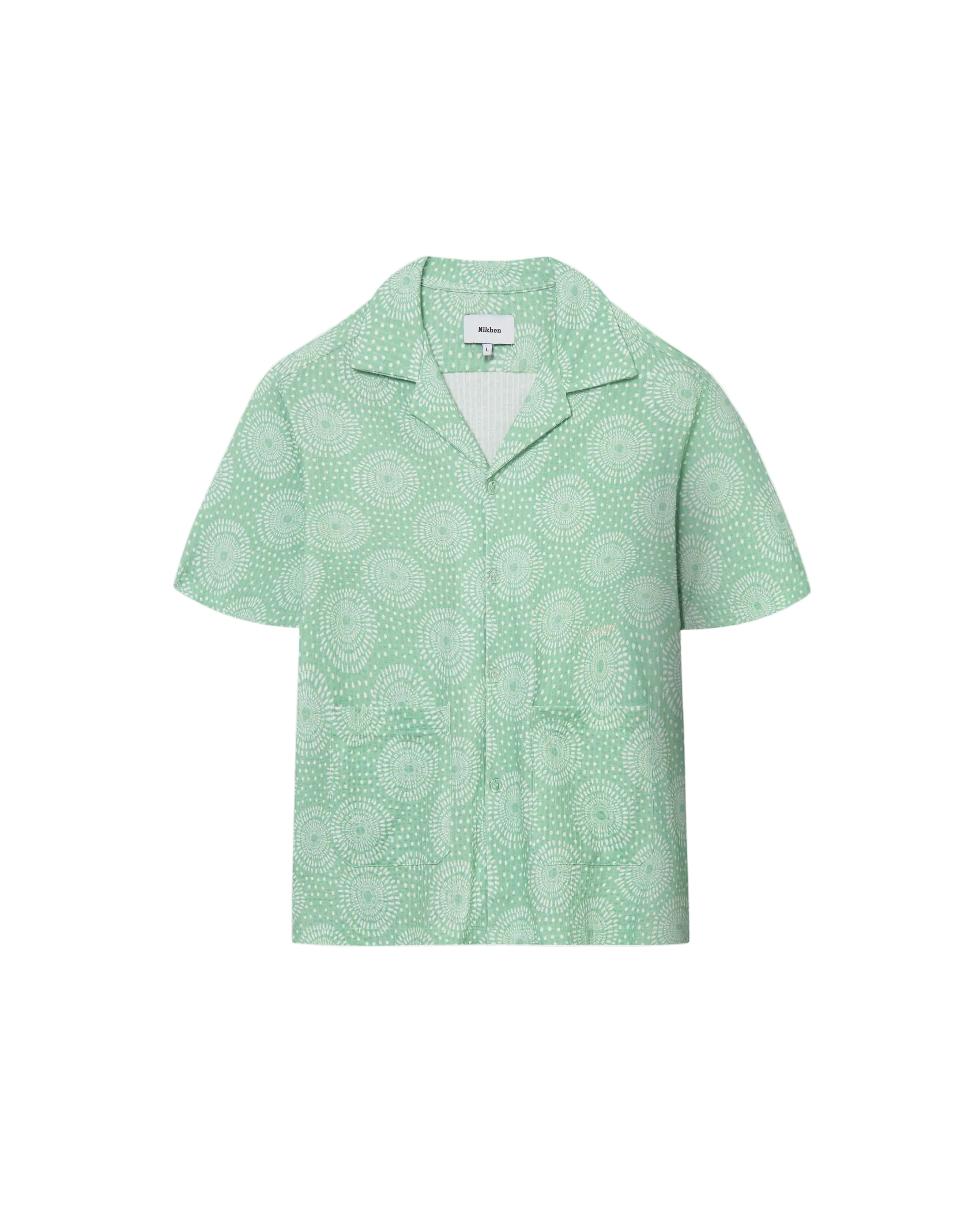 A short-sleeved green shirt with a camp collar and mother-of-pearl buttons, displayed against a plain background.