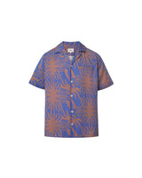 A short-sleeved purple shirt with a multicolor graphic pattern, an open collar, and button closure at the front.