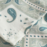 Close up on sleeve on a Vintage pale yellow short sleeved shirt with paisley pattern