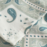 Close up on sleeve on a Vintage pale yellow short sleeved shirt with paisley pattern