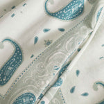 close up on pocket on vintage pale yellow paisley pattern long pants