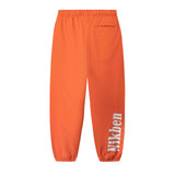 Orange pants with a brand logo on side