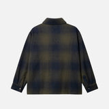 Back detail of dark blue and green flannel shirt