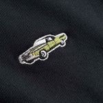 Embroidered design of a car on a black fabric