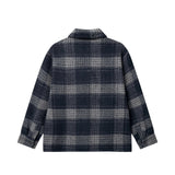 Backside of navy grey checkered shirt.