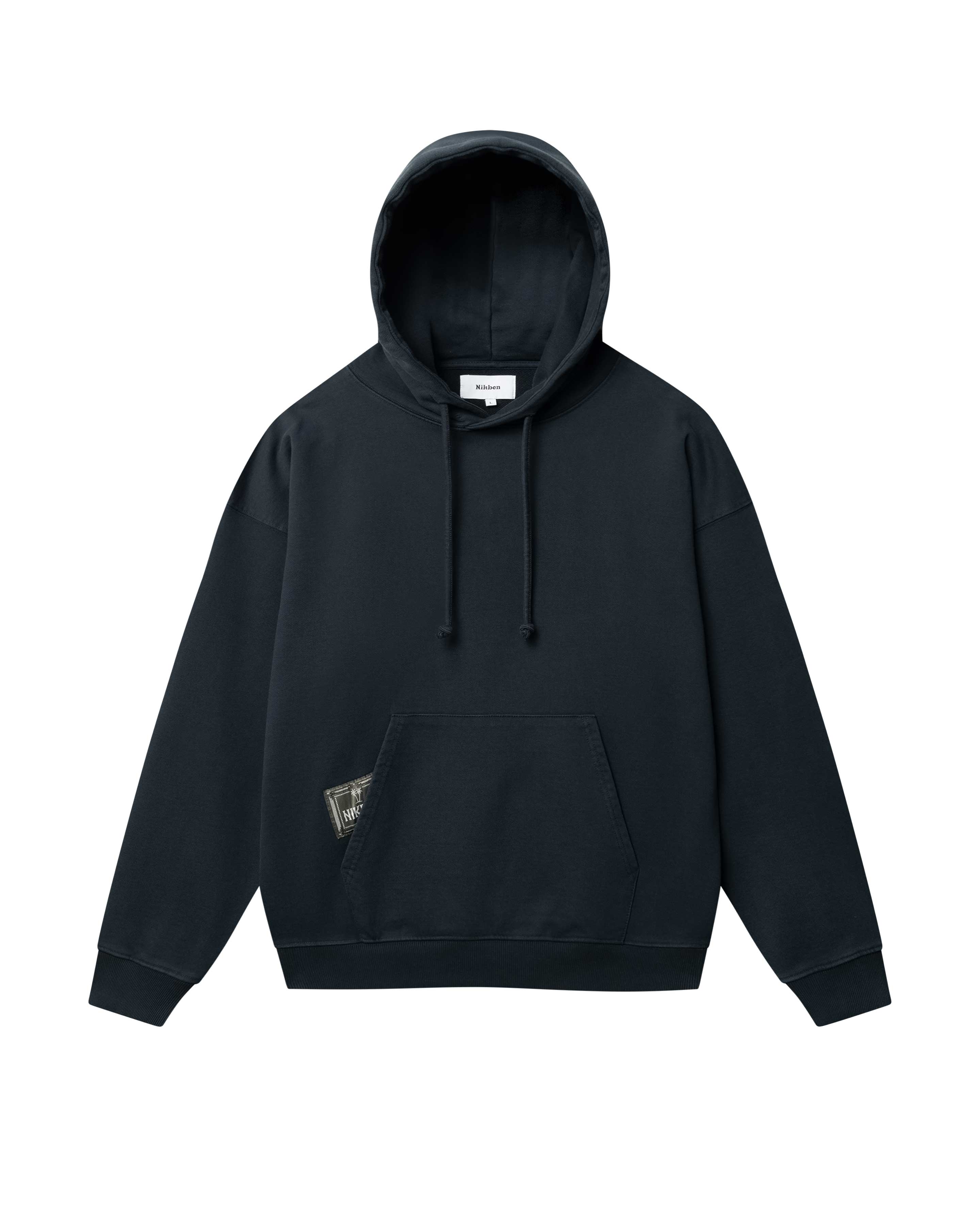 black hoodie with green Nikben patch label next to left pocket 