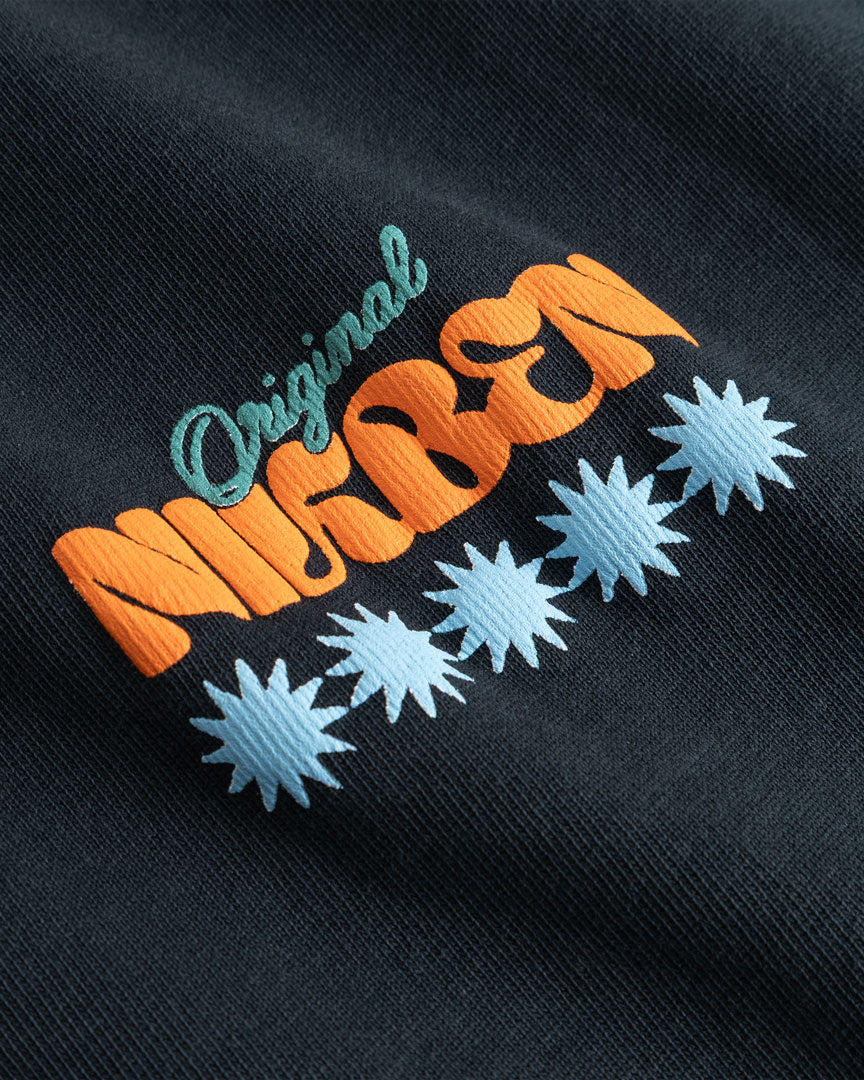 Closeup view of multicolored Nikben logo on black T-shirt