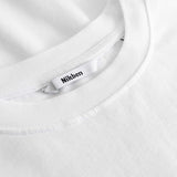 Closeup view of Nikben necklabel on white T-shirt