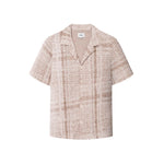 A beige Encinitas shirt with short sleeves and pearl buttons, displaying detailed jacquard stitching.