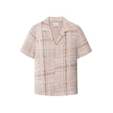 A beige Encinitas shirt with short sleeves and pearl buttons, displaying detailed jacquard stitching.
