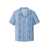 A short-sleeved blue shirt with geometric jacquard stitching, collar, and button-up front.