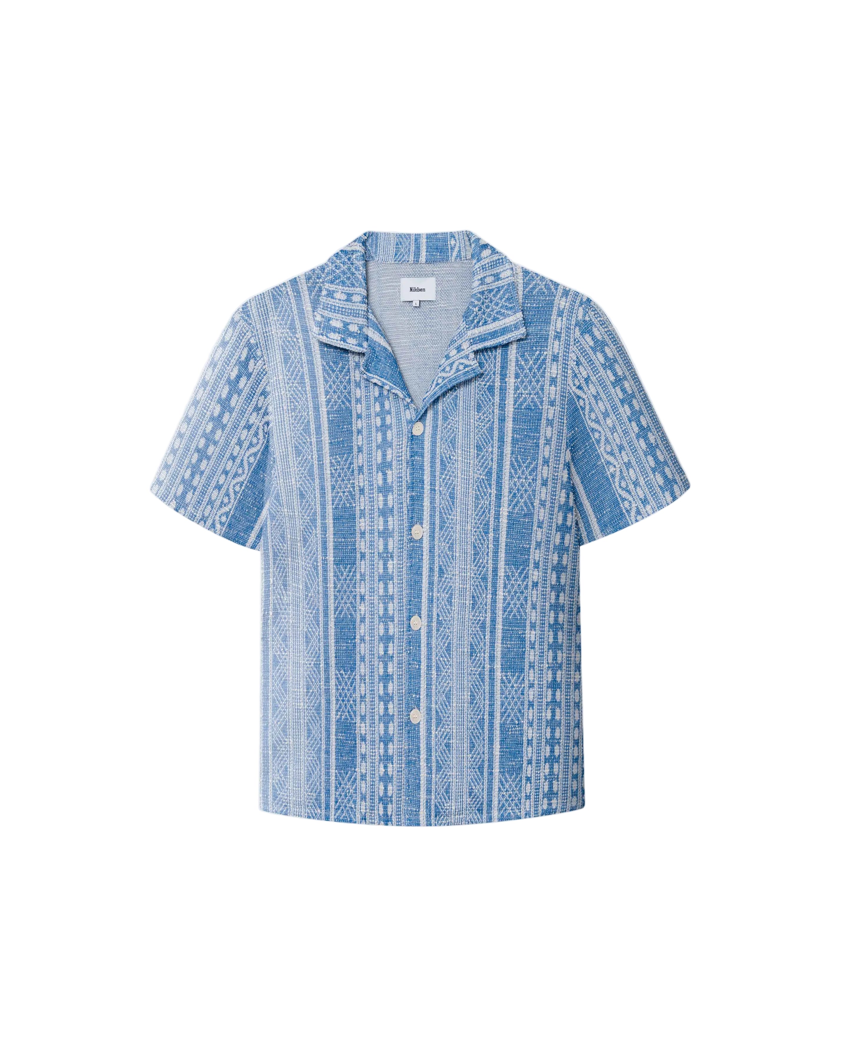 A short-sleeved blue shirt with geometric jacquard stitching, collar, and button-up front.