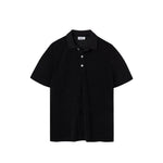 Black polo shirt on a white background