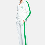 male model wearing white and green corduroy track suit pants with NB embroidery