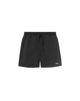 A pair of black, unisex, organic cotton sweat shorts with an elastic drawstring and two side pockets.