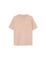 A sand colored t-shirt with "jamaica" text print on a sand colored t-shirt