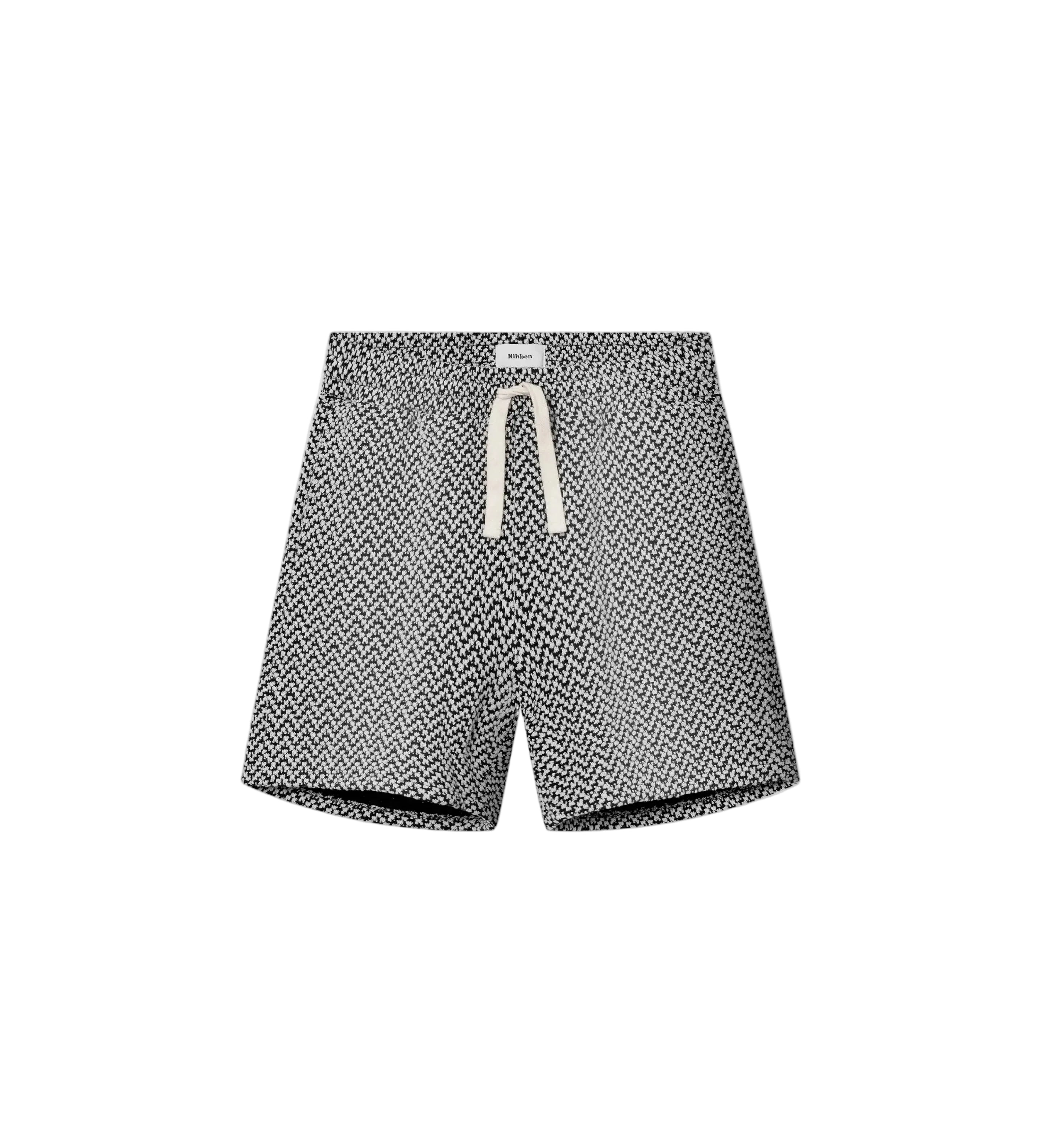 A pair of mid-length black shorts with a geometric jacquard texture, featuring a relaxed fit and a drawstring waistband.