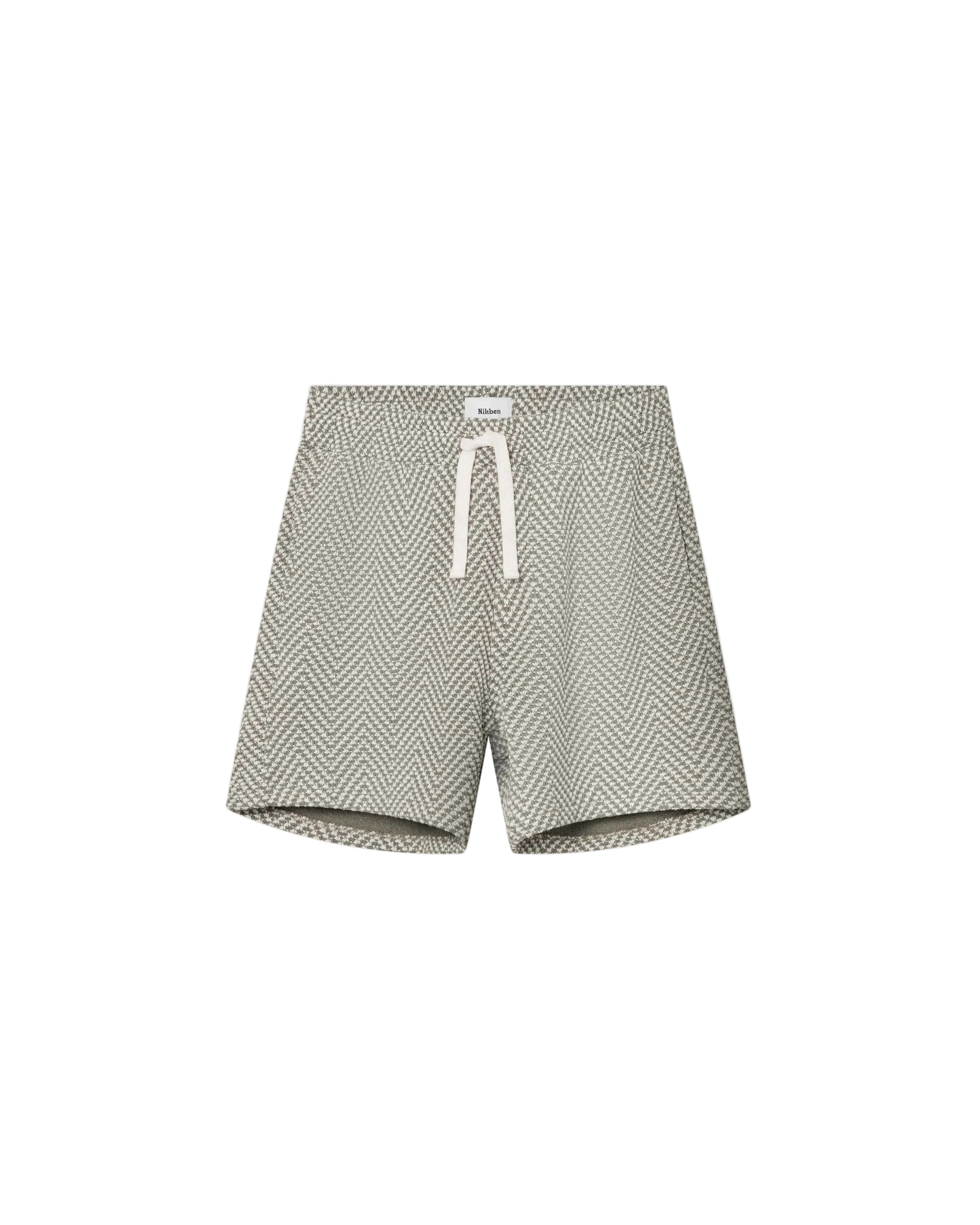 A pair of mid-length green jacquard shorts with a relaxed fit, featuring two side pockets and a back pocket, made from a polyester-cotton blend.