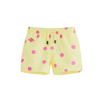 Yellow kids swim trunks with pink dots