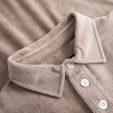 Collar and white buttons on beige shirt