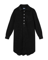 Black kaftan in terry toweling fabric. With half button closure and one chest pocket