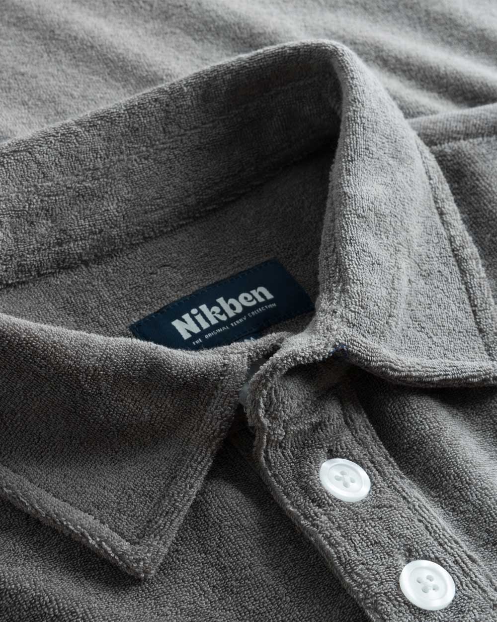 Collar and buttons on grey shirt