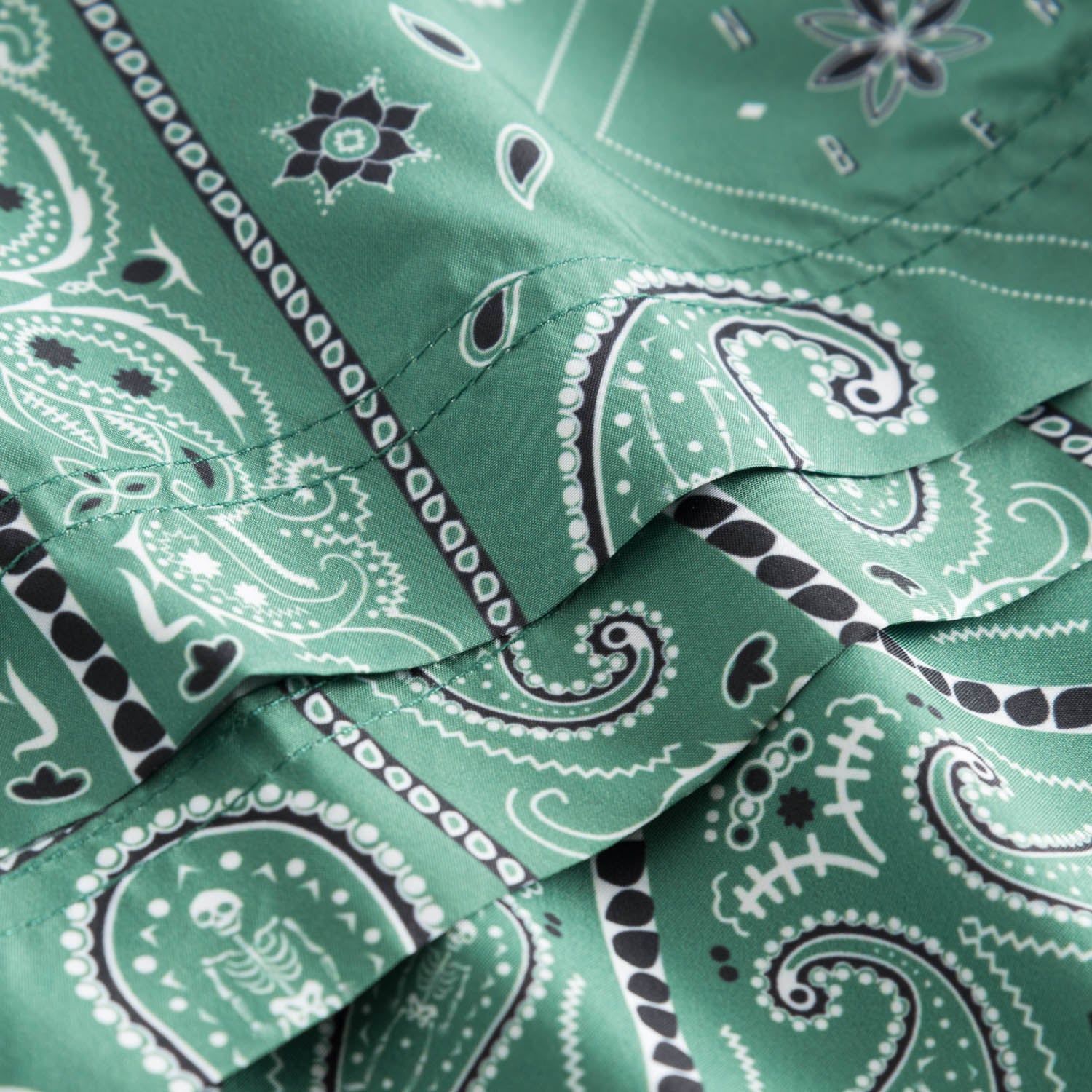 Close up on green swim trunks