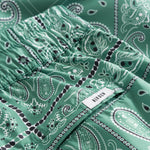 Back pocket logo on green swim trunks