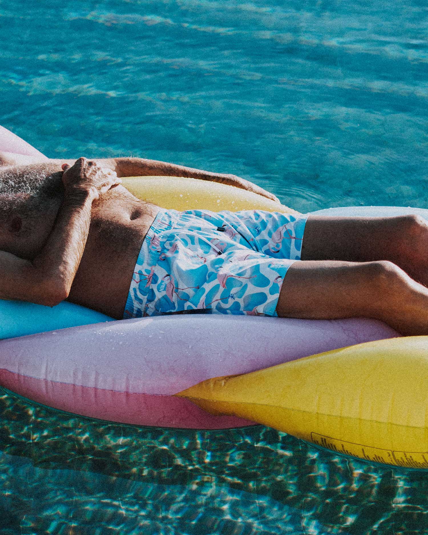 Men wearing multicolor swimtrunks