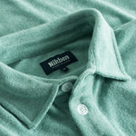 Collar on green shirt