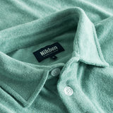 Collar on green shirt