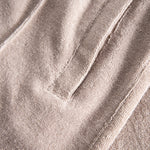 Side pocket on cashmere colored pants in Terry toweling fabric