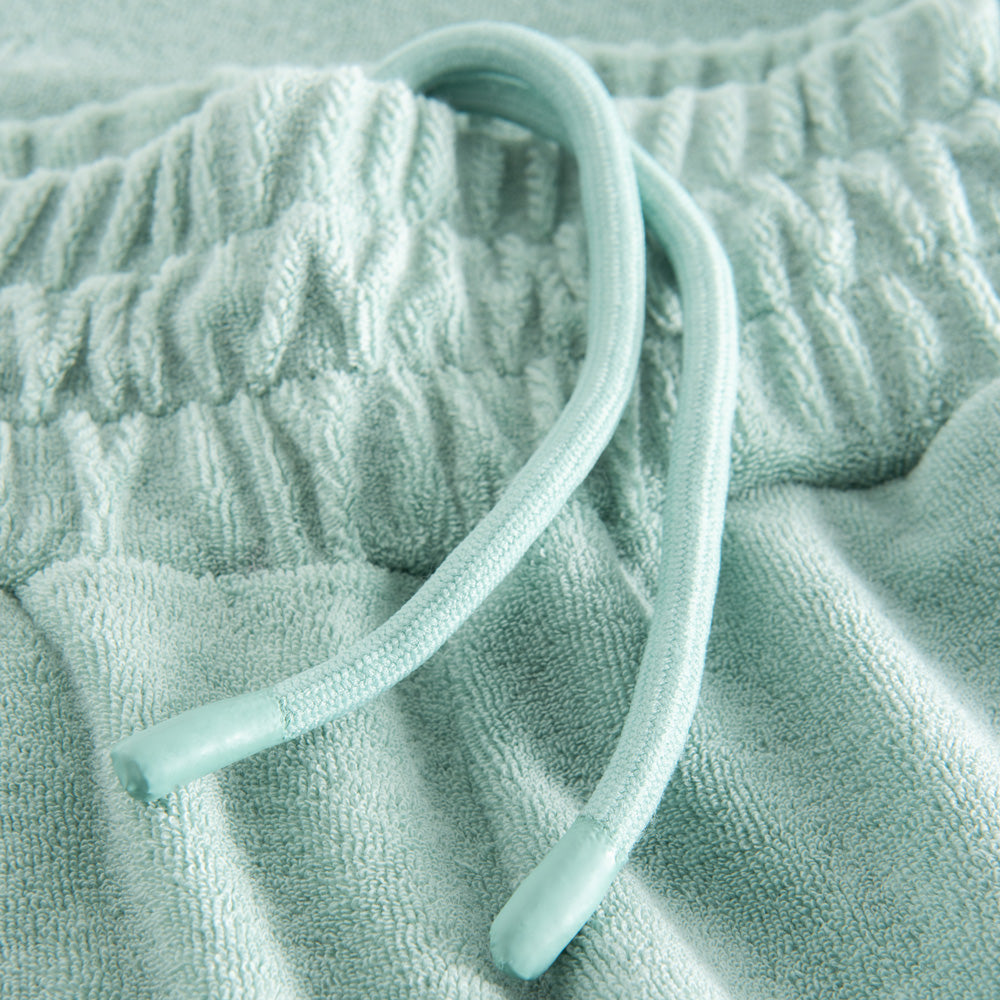 Green drawstring on Terry towelling pants