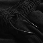 Drawstring waistband on black terry towelling shorts