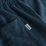 Logo on back pocket on navy blue terry towelling shorts